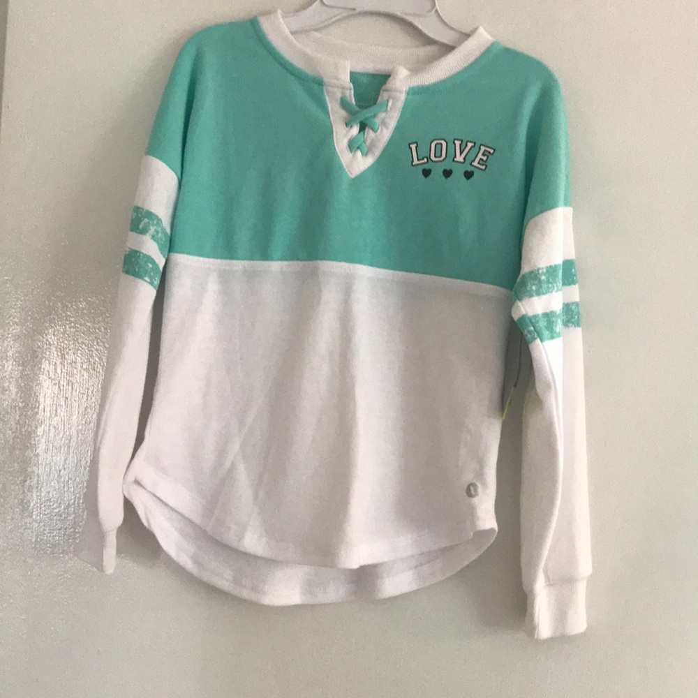 Xersion , size 7/8 , color green and white.